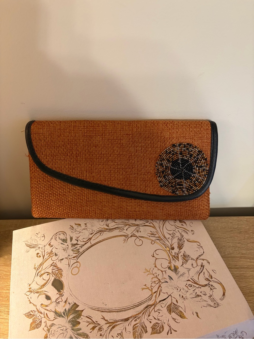Woven Orange Clutch with Black Trim and Beaded Accent
